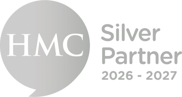 HMC Silver Partner 2026–2027 logo featuring a silver circular speech mark with ‘HMC’ in white text beside the words ‘Silver Partner 2026–2027’ in silver lettering.