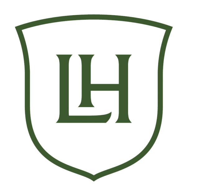 Lodestone House logo with a green shield outline containing the letters “LH” in a classic serif style.