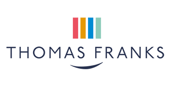 Thomas Franks logo with a navy background and a multicoloured ribbon/bookmark icon above.